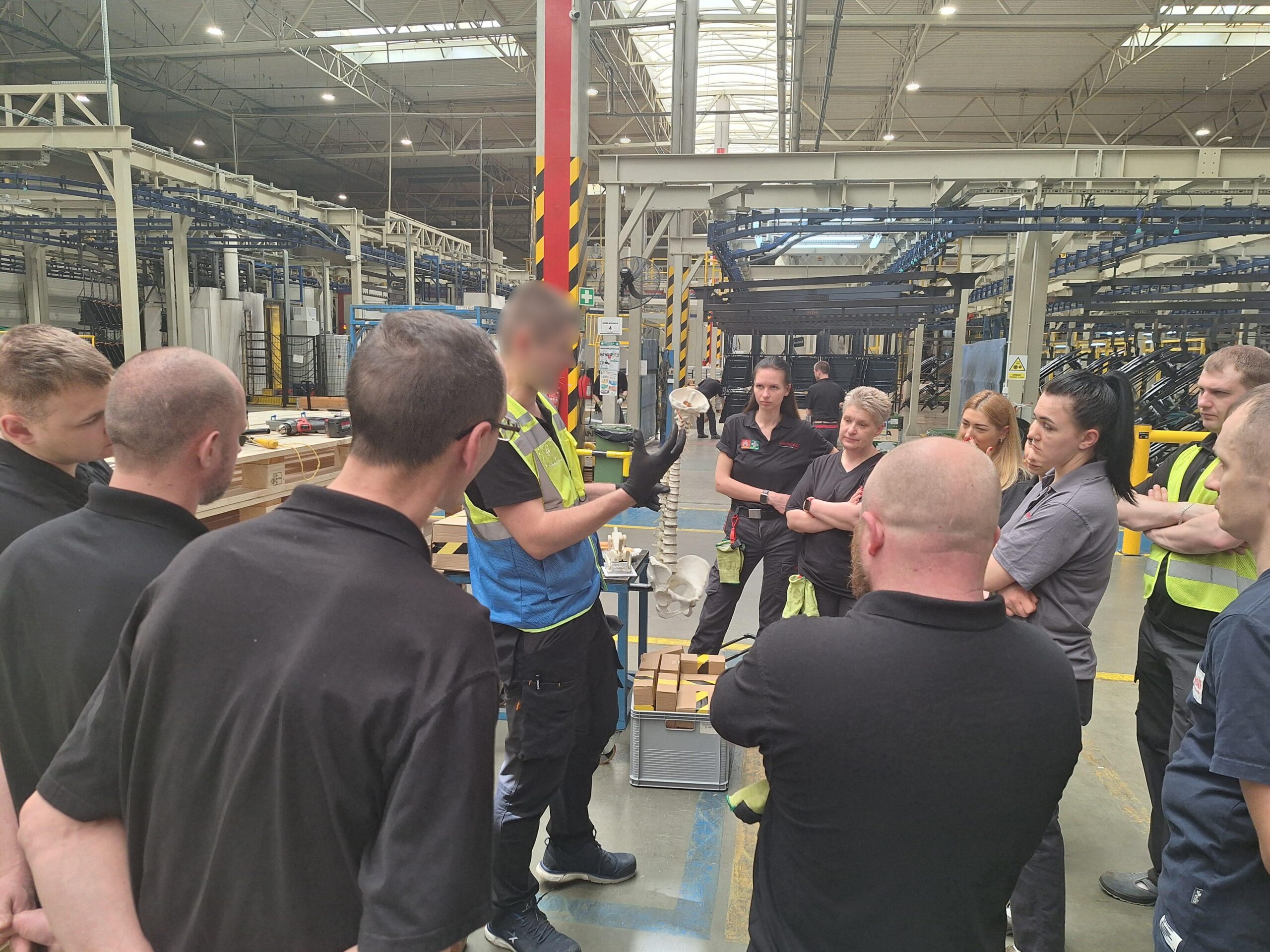 Employees attending an ergonomics workshop focused on musculoskeletal health and safe posture in the workplace